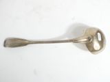 a spoon and a spoon rest on a white surface