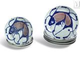 several plates with blue and white designs are stacked on top of each other