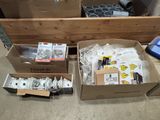 a box of assorted items sitting on the floor
