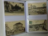 a person holding a book open to show pictures of old buildings