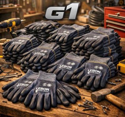 a bunch of work gloves sitting on top of a wooden table