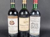three bottles of wine sitting on top of a table next to each other