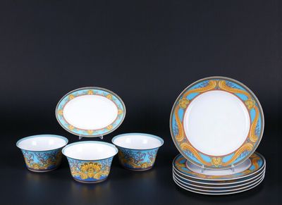 an image of a group of blue and gold plates and bowls