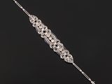 a diamond and platinum - plated hair comb