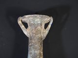 a vase that is sitting on a black surface