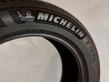 a close up of a tire on a white surface