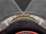 a close up of a tire with a red rim