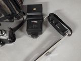 a camera and a bag on a table next to a camera