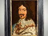 portrait of a man with a moustache in a black frame