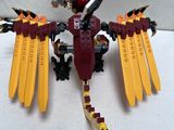 a lego dragon that is sitting on a table