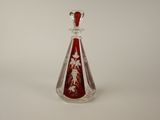an image of a glass bottle with a red and white design on it