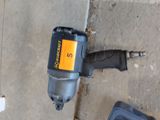 an image of a cordless drill on the ground