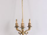 a gold colored lamp that is sitting on a table