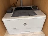 a printer that is sitting on top of a shelf