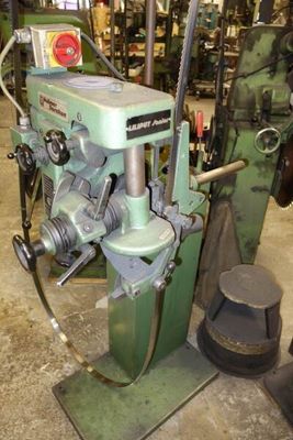 a machine that is sitting in a room with a lot of tools