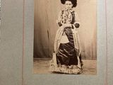 an old photo of a woman in a dress