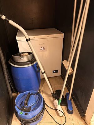 a blue bucket with a vacuum and a blue bucket with a mop on it