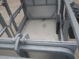 a metal cage with a metal latch on it