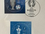 a close up of a stamp with a soccer ball and a cup on it