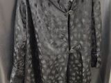 an image of a coat hanging on a hanger in a room