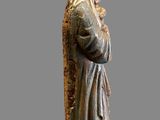 an image of a statue of a woman holding a baby