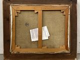 a close up of a picture frame with a piece of paper on it
