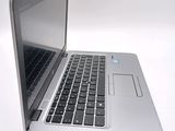 a close up of a laptop computer on a white surface