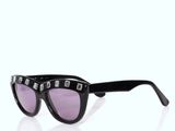 a pair of black sunglasses with purple lenses on a white background