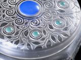 an image of a glass box with a blue stone in it