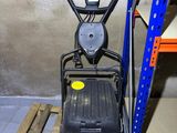 a close up of a machine on a pallet in a warehouse