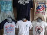 many t - shirts on display in a store