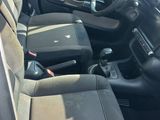 the interior of a car with a steering wheel and a dashboard
