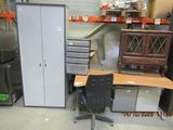 a desk with a chair and a cabinet in a room