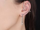 the ear cuff is adorned with a chain and rhines