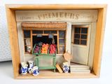 a small wooden box with a fruit stand inside of it