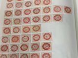 an open book with a picture of a number of stamps on it