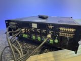 a close up of a radio on a table with a bunch of wires