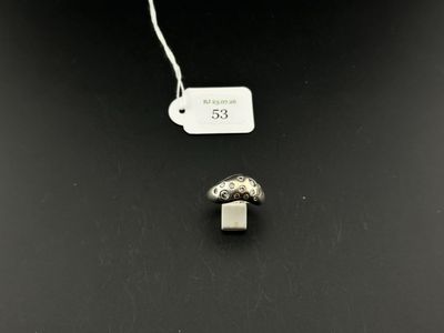 a close up of a mushroom shaped object with a tag attached to it