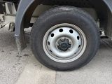a flat tire on a semi truck parked on the side of the road