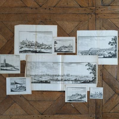 a bunch of pictures on the wall of a room