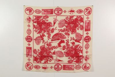 a red and white scarf hanging on a wall