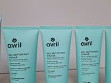 four different types of skin care products are lined up on a table