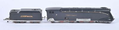 two toy trains sitting next to each other on a white surface
