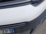 a close up of the front of a white car