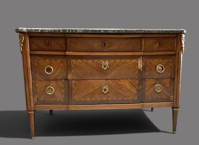 a marble top chest of drawers with a marble top