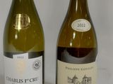 two bottles of wine are sitting next to each other on a table