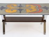 a glass table with a tile design on top of it