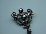 an image of a close up of a black and white broochle