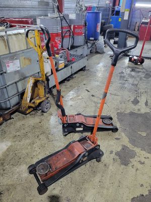 a scooter that is sitting on the floor in the garage