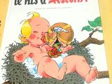 une photo d'un livre sur lequel figure un bébé dans un nid, posé sur une table